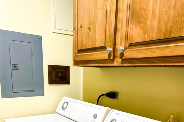 Laundry room with full-size washer and dryer.