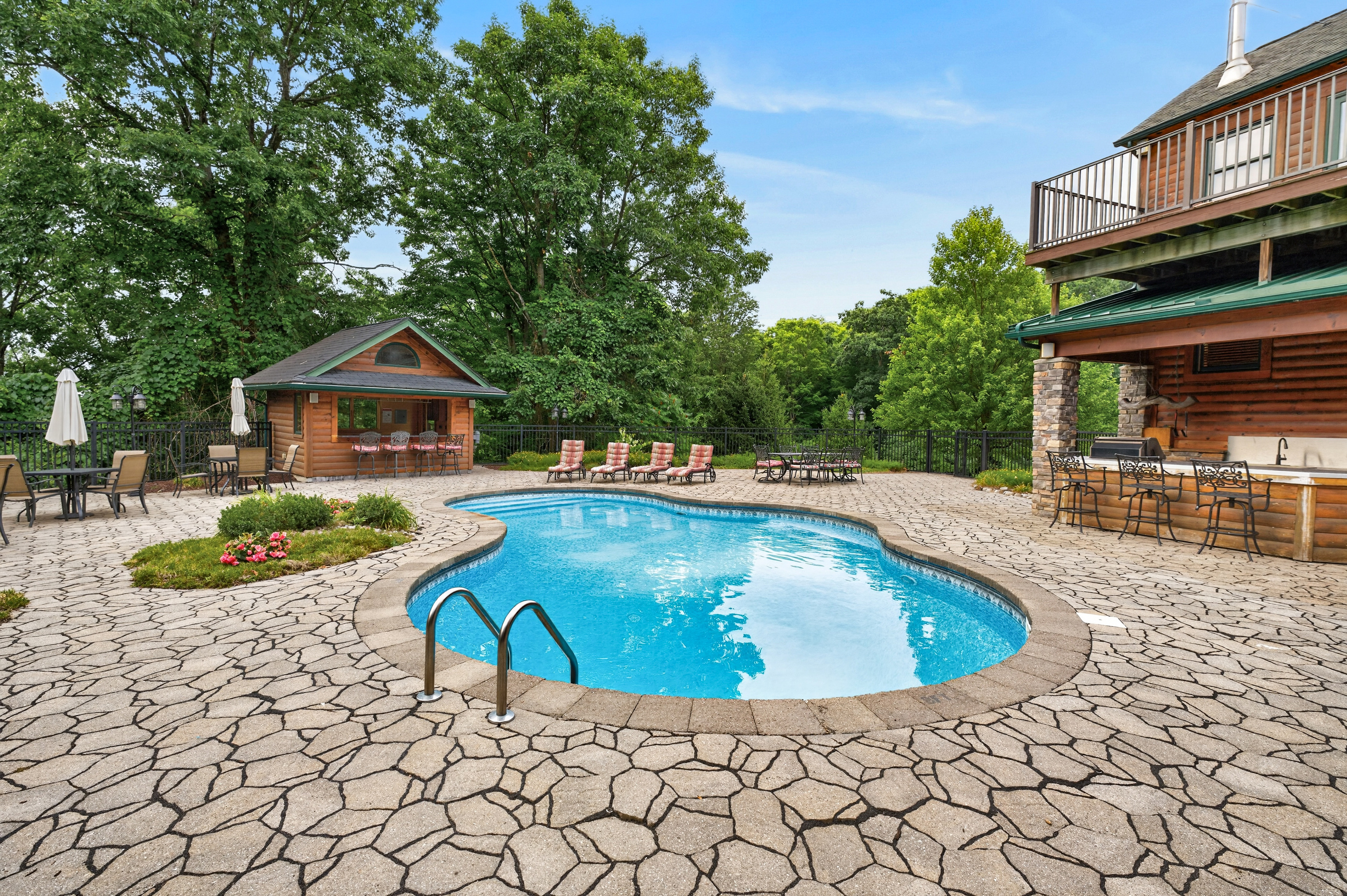 Curved pool with stone surround