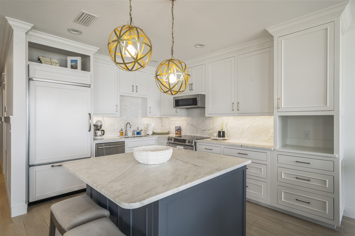 Kitchen with Marble Countertops and Backsplash