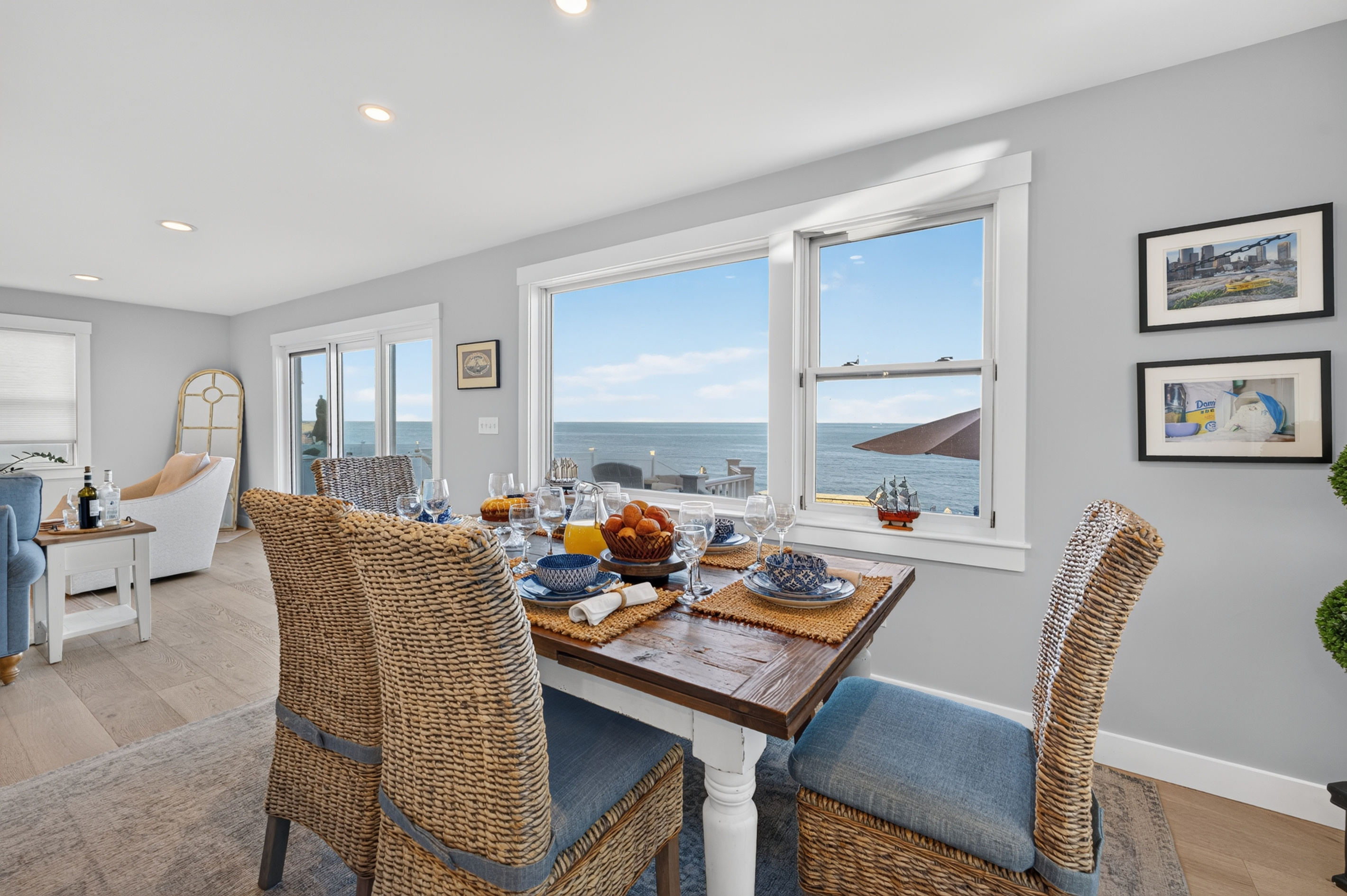 Bright dining area with beautiful ocean views and seating for shared meals