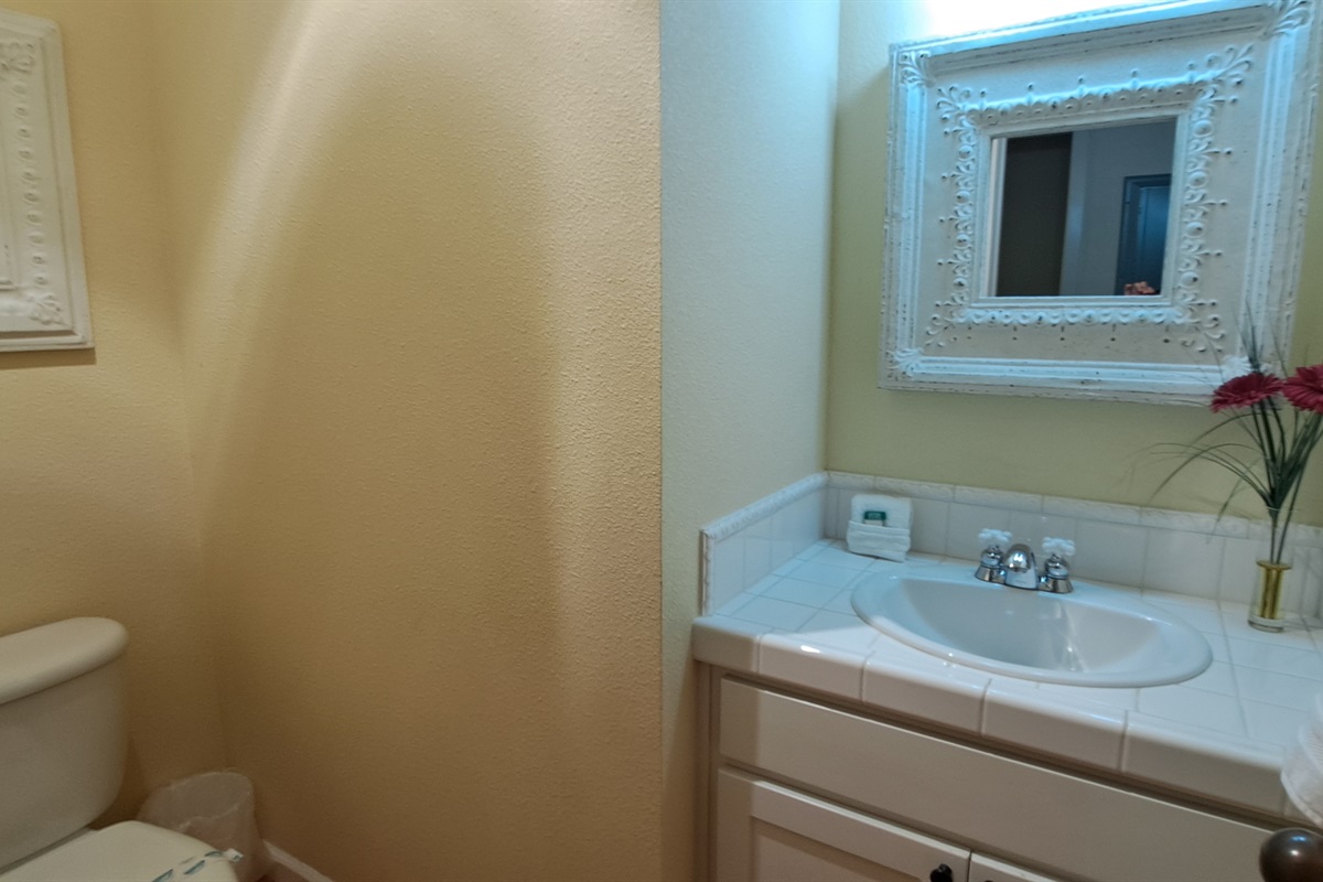 Convenient half bath located just off the main living area.