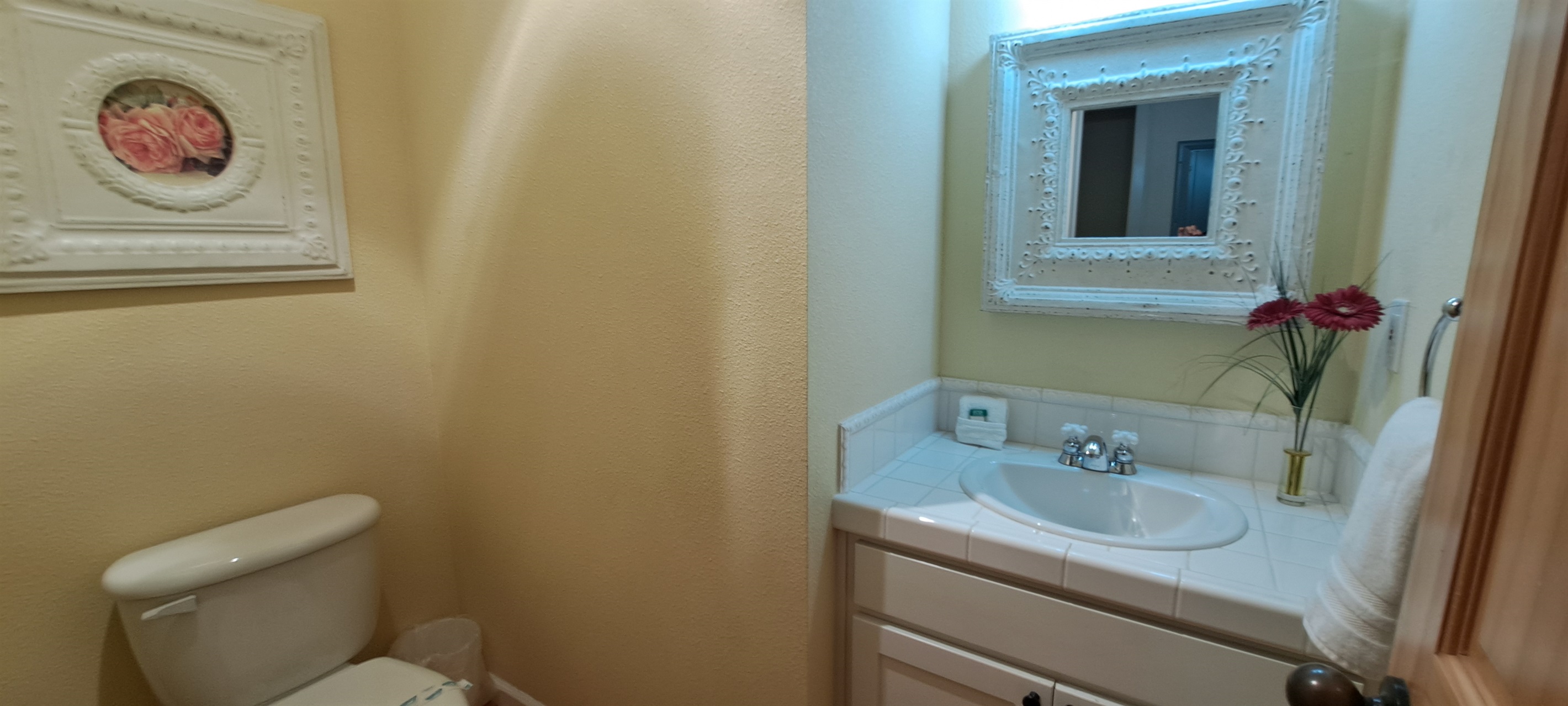 Convenient half bath located just off the main living area.