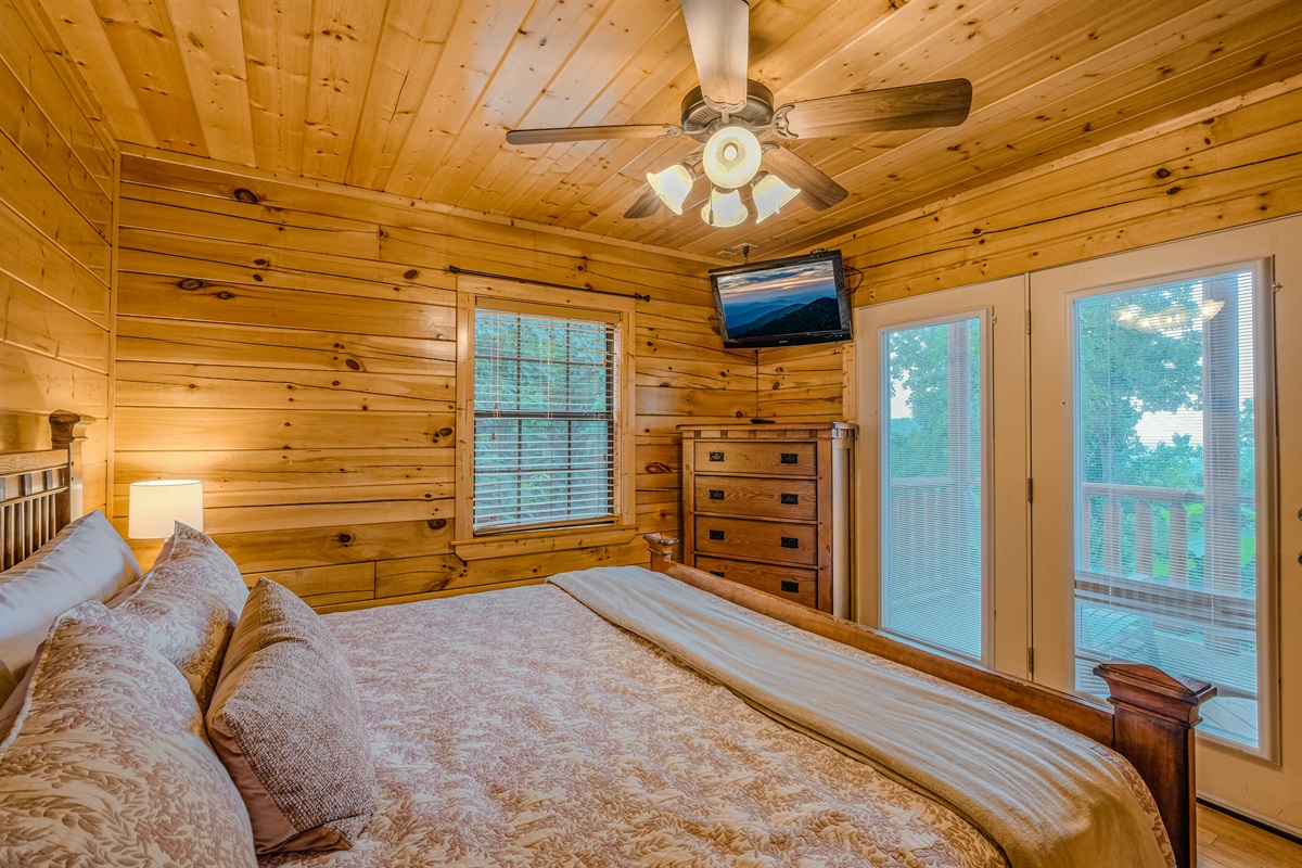 Second bedroom on lower level with king bed, TV and private access to lower deck