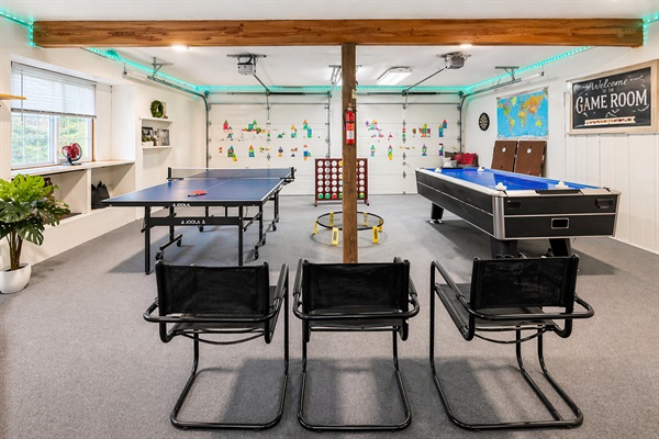 Game room with ping pong, air hockey, corn hole, spike ball, life size connect four and space to hang out