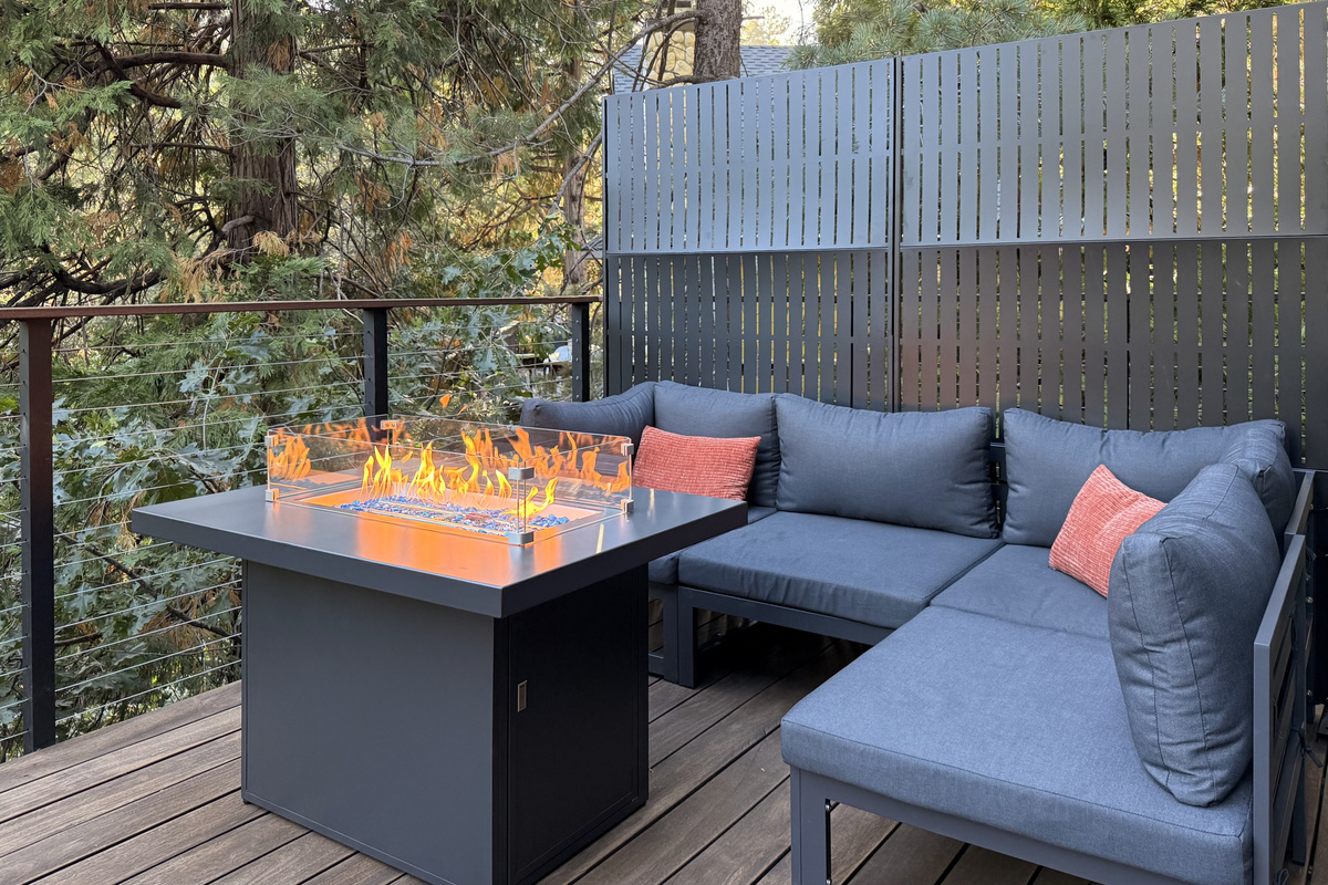 Fire table and lounge seating on the Upper Deck.