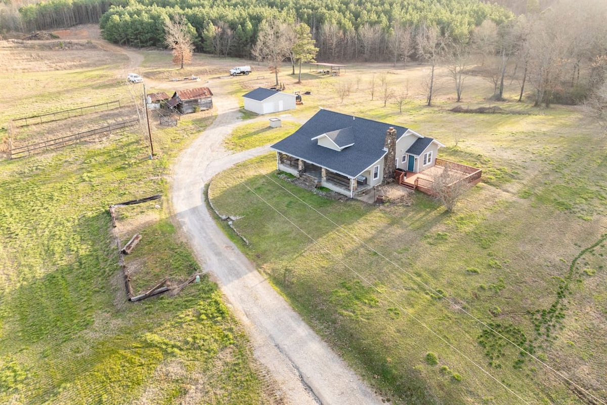 Charming Getaway: Embrace nature from this spacious retreat surrounded by lush woods!