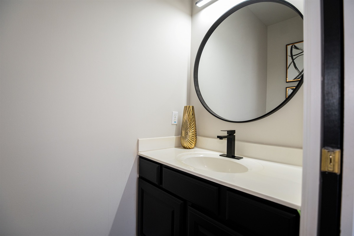 Conveniently located on the main floor, this half bath is perfect for quick refreshes and easy access from the common areas.
