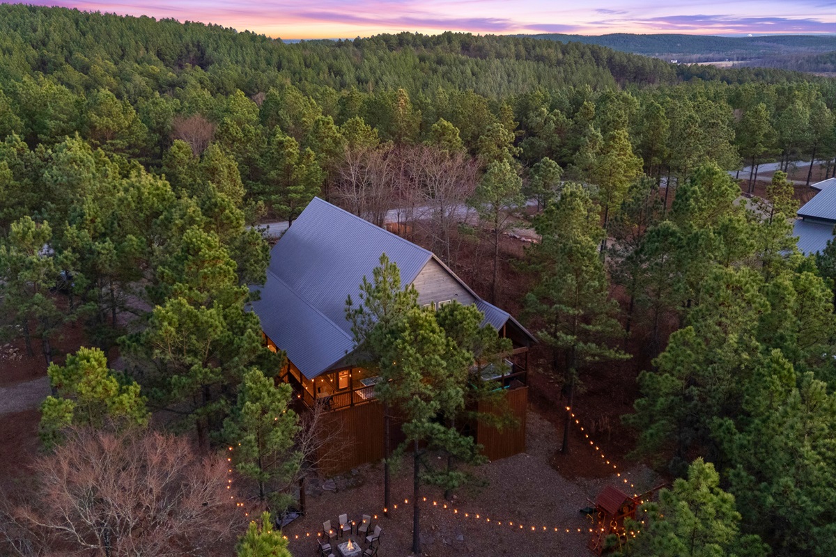Ending with another stunning overhead view, you can see the cabin glowing in the forest, making it the perfect place to unplug and unwind.