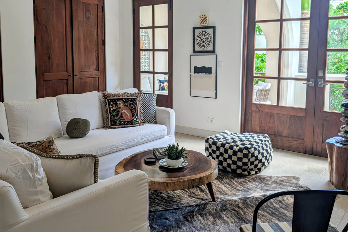 Bright and spacious living room opens to expansive private patio with plunge pool
