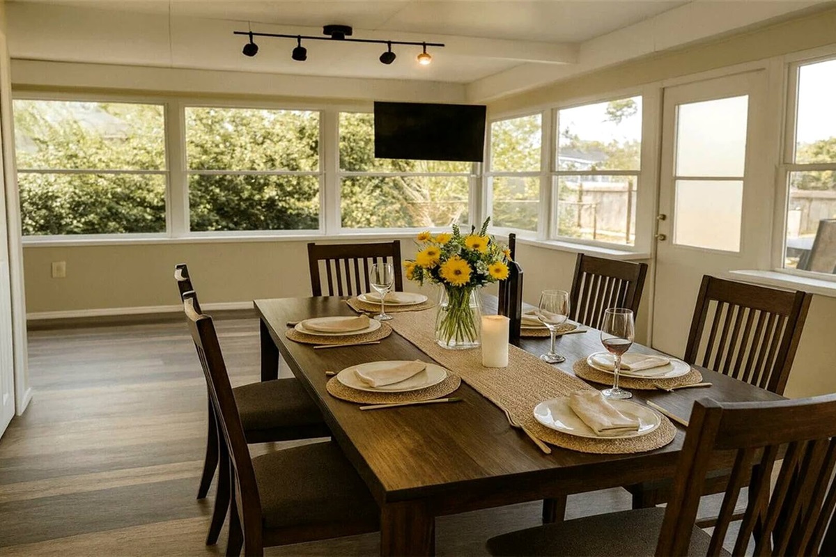 Dining Area - Sunlit dining space with expansive windows and modern furnishings
