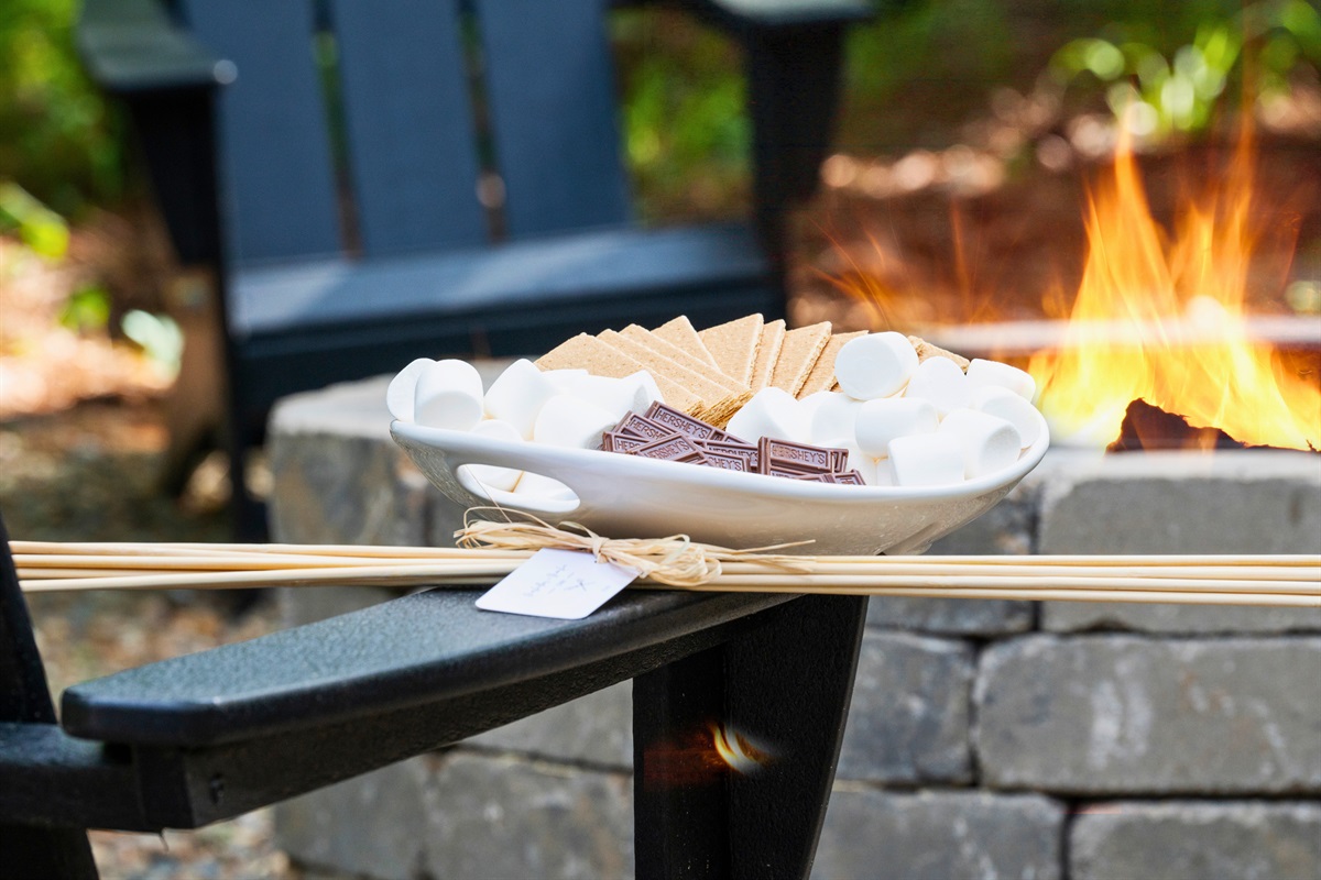 Indulge in the timeless joy of making s'mores with a ready-to-use kit, conveniently set by the inviting warmth of an outdoor fire pit.
