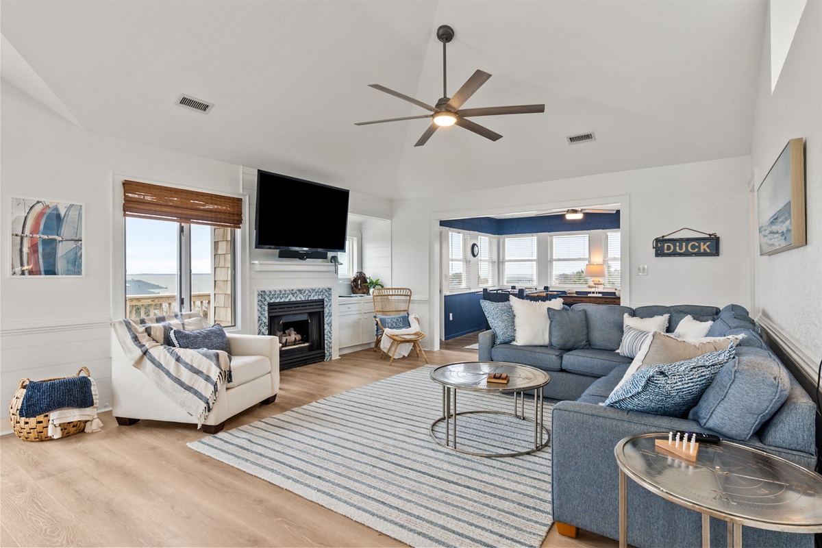 Another look at the living space with bright windows and a cozy feel.