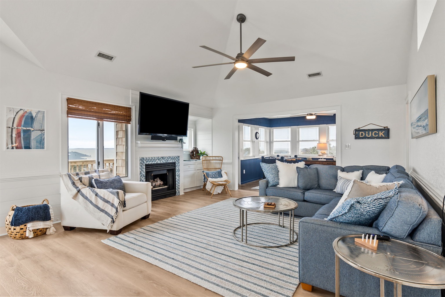 Another look at the living space with bright windows and a cozy feel.