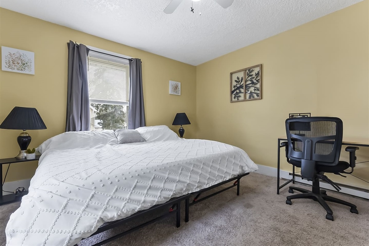 Bedroom with dedicated workspace.