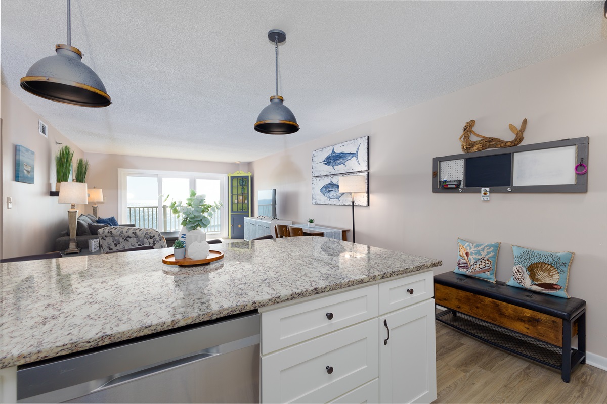 The design connects the living area and kitchen