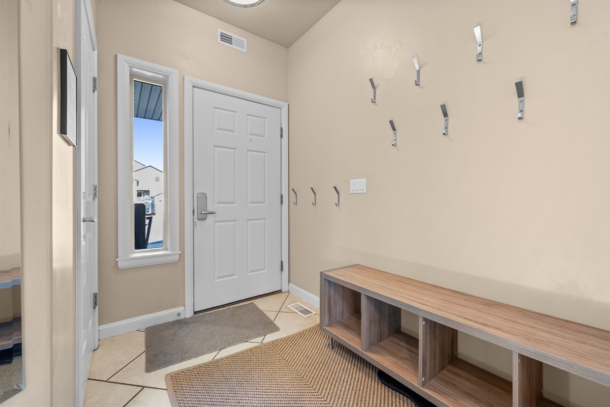 Welcoming entryway with plenty of space for jackets, boots, and ski gear after outdoor adventures.