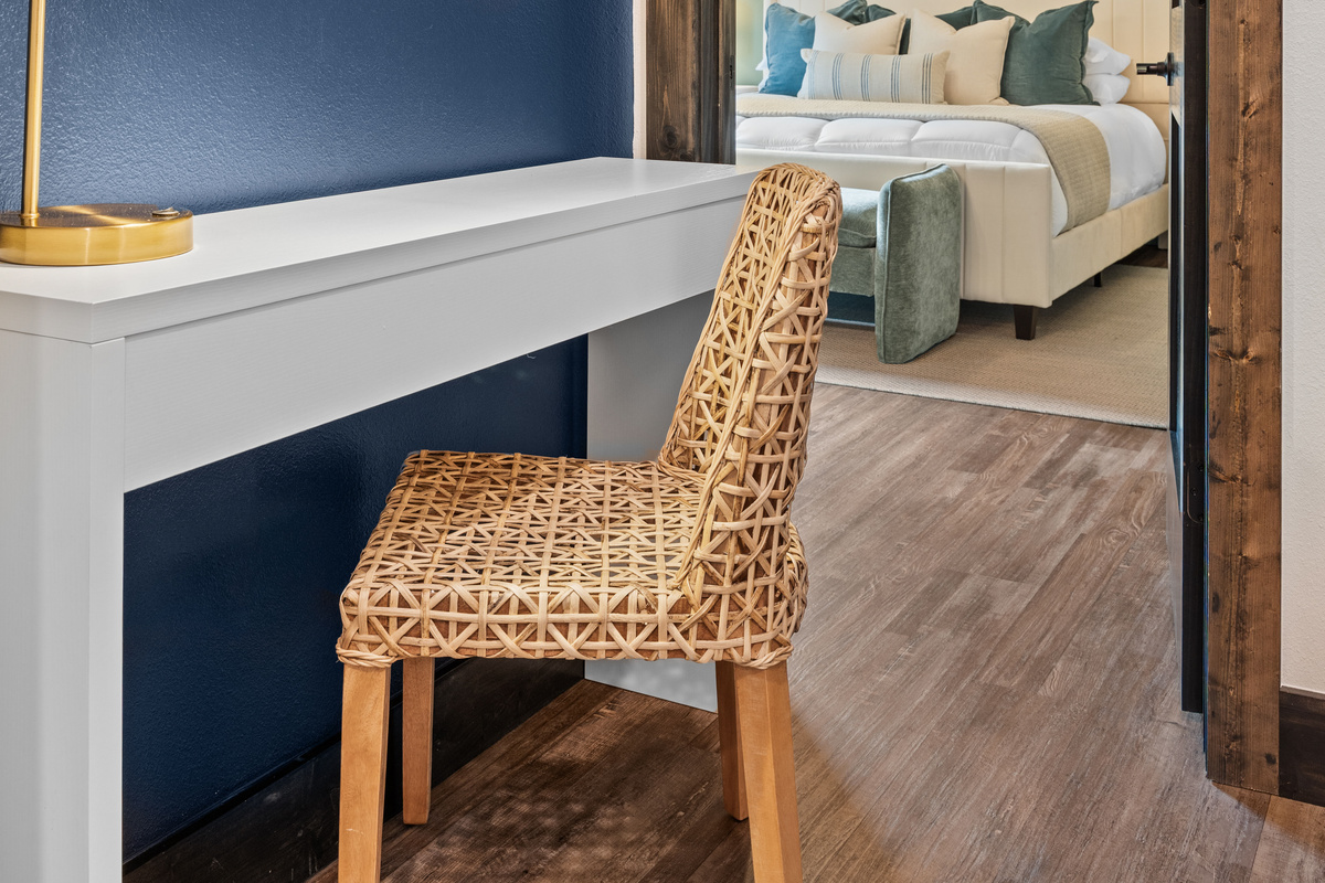 A desk nook offers a quiet spot to work remotely, with the next bedroom just through the door.