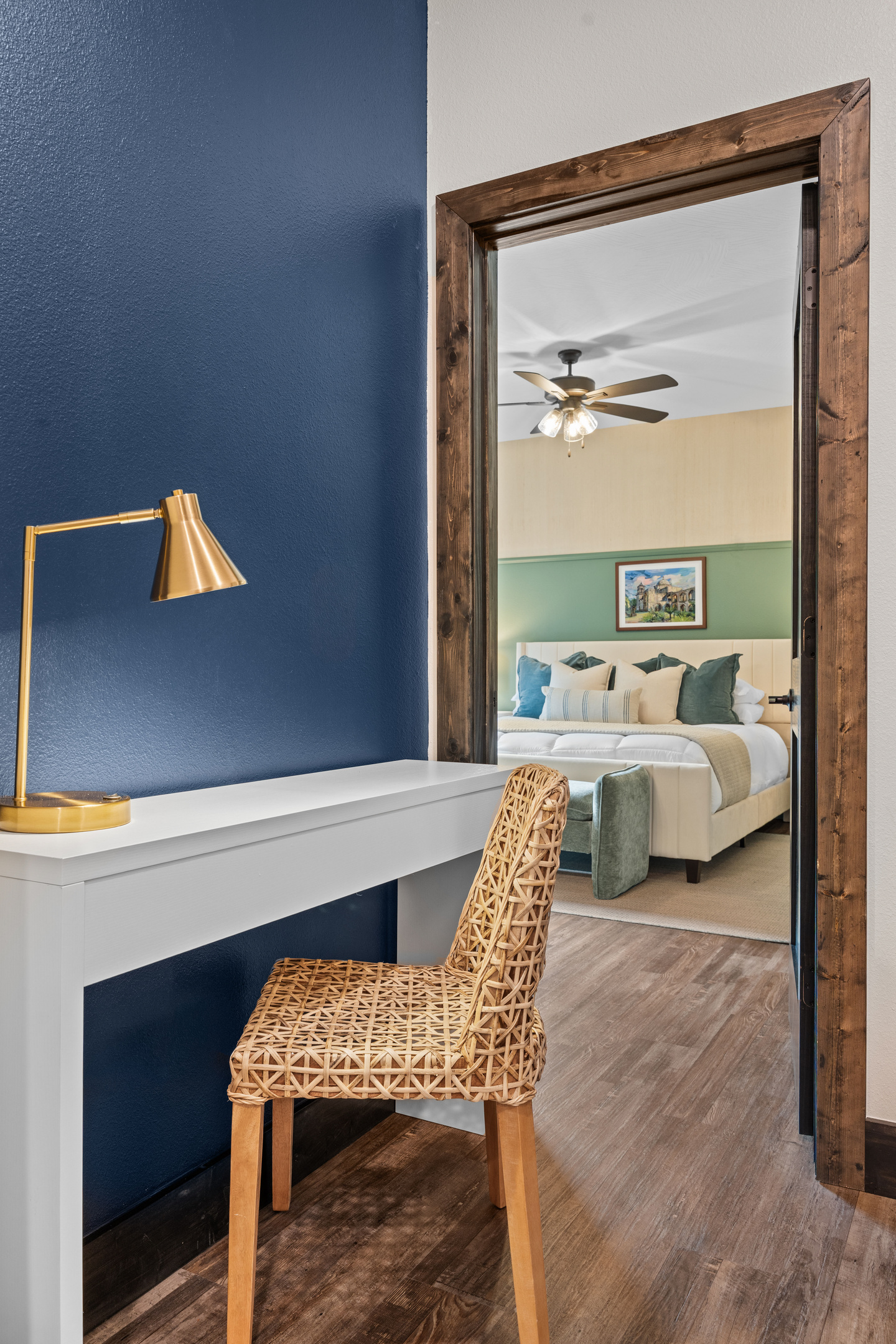 A desk nook offers a quiet spot to work remotely, with the next bedroom just through the door.