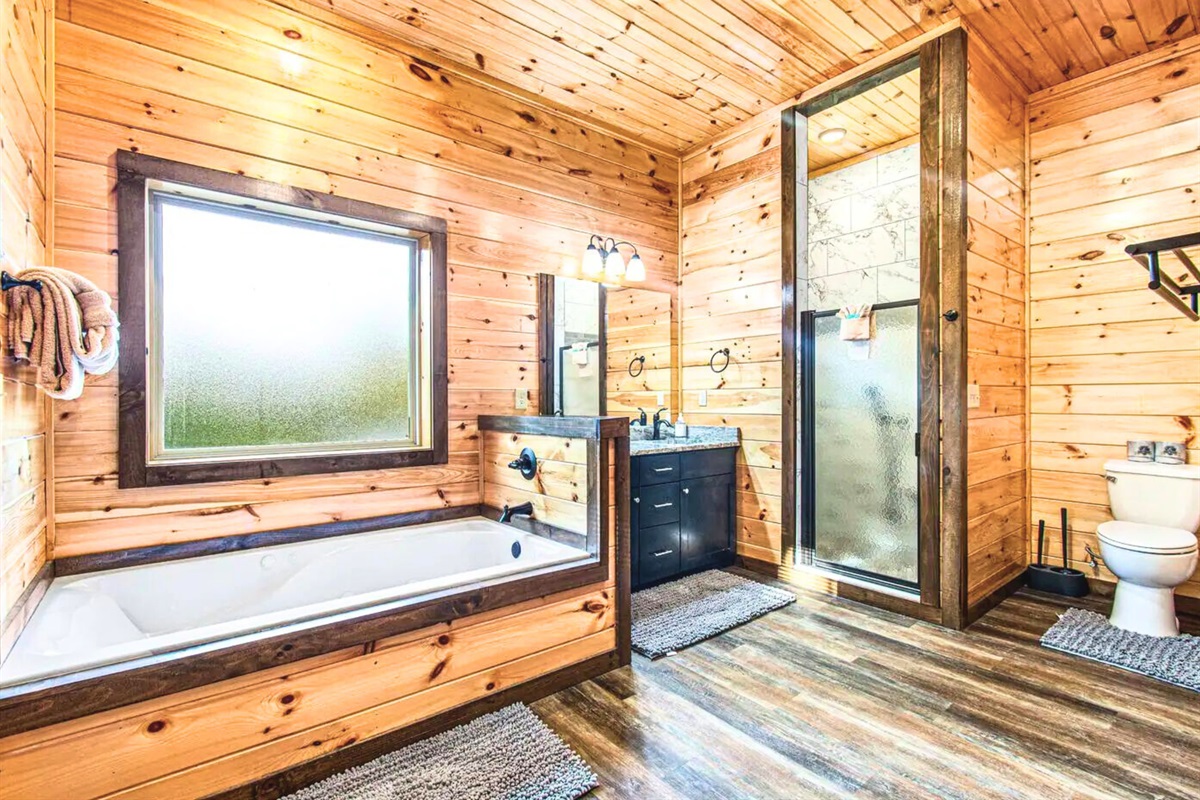 One of Two Upstairs Ensuite Bathrooms with Deep Soaking Tub and Walk-In Shower