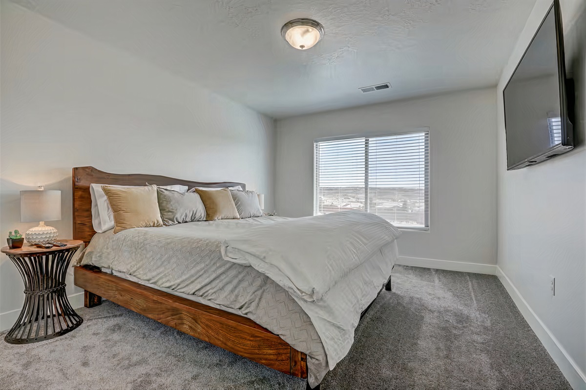 King bed with Smart TV and breathtaking views from window.