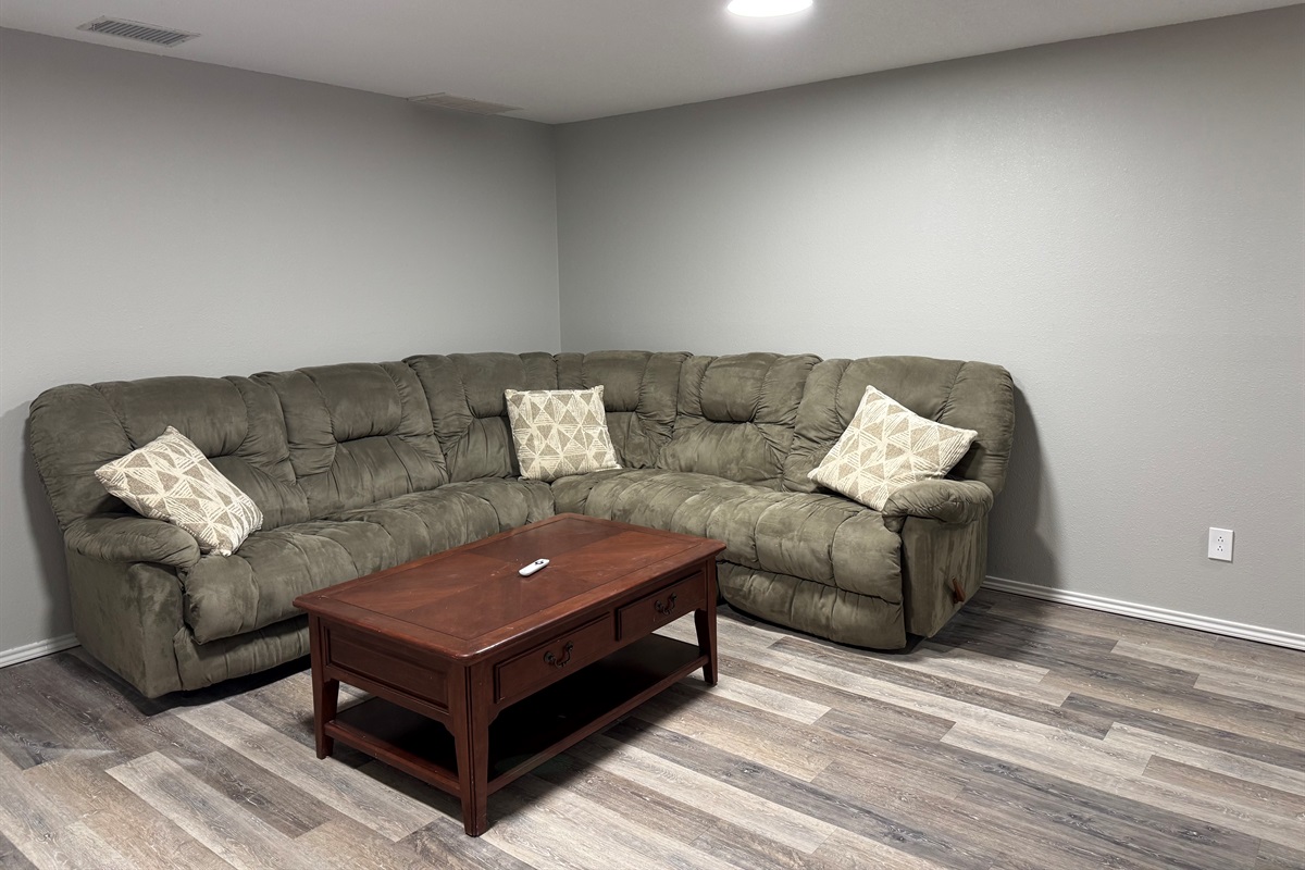 Basement with queen sofa sleeper and large tv