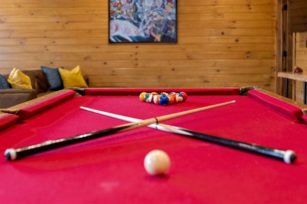 Full-size pool table for late-night games and rainy-day fun.