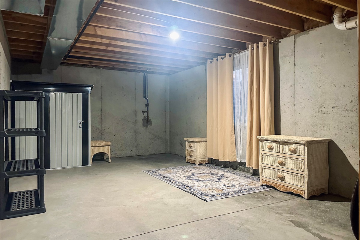 Expansive west-side basement area ideal for additional storage, perfect for longer stays requiring extra room.