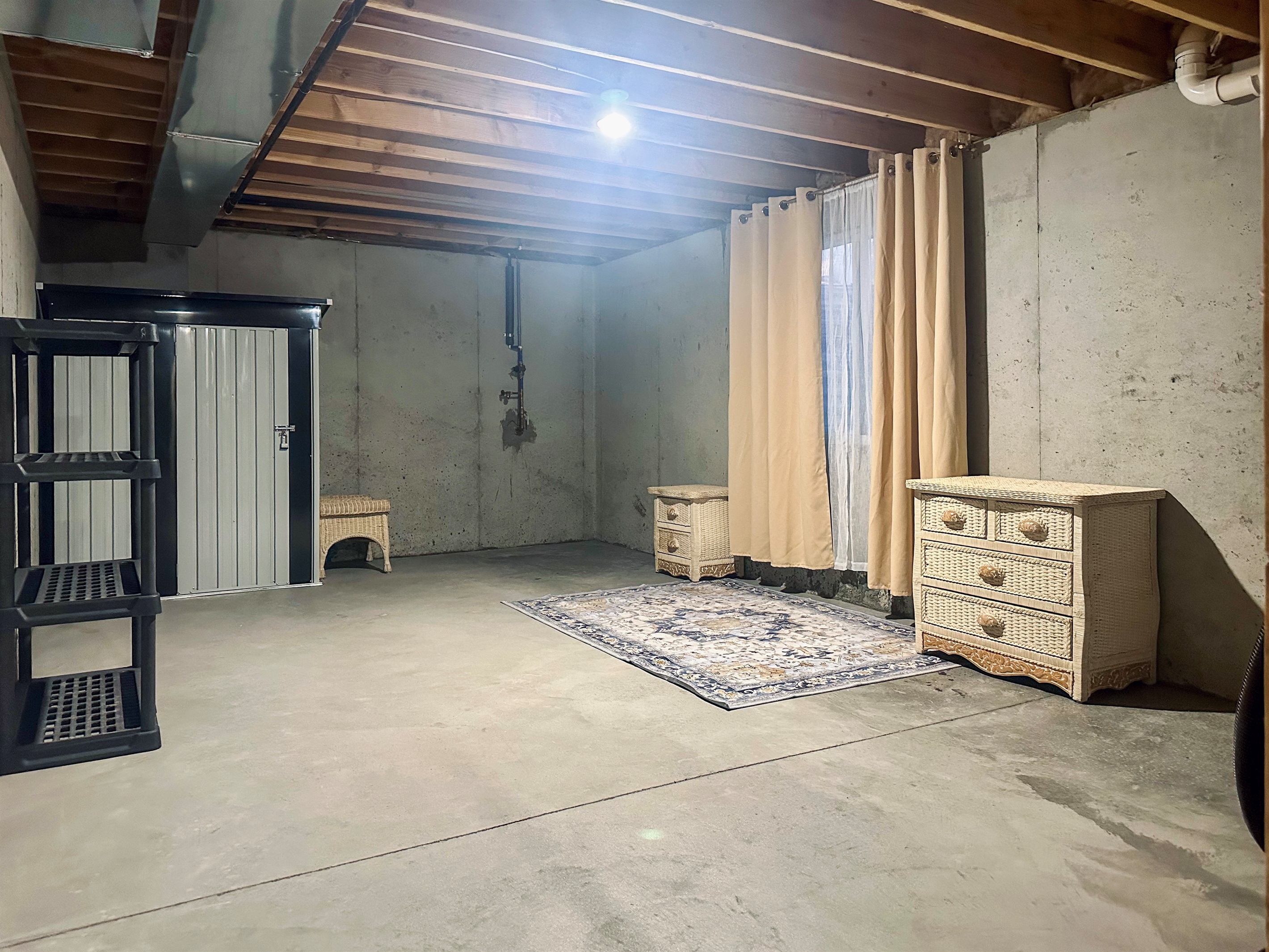 Expansive west-side basement area ideal for additional storage, perfect for longer stays requiring extra room.