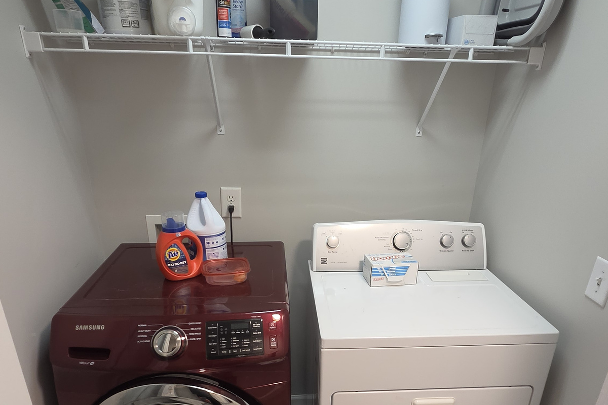 Laundry room upstairs with full size washer and dryer