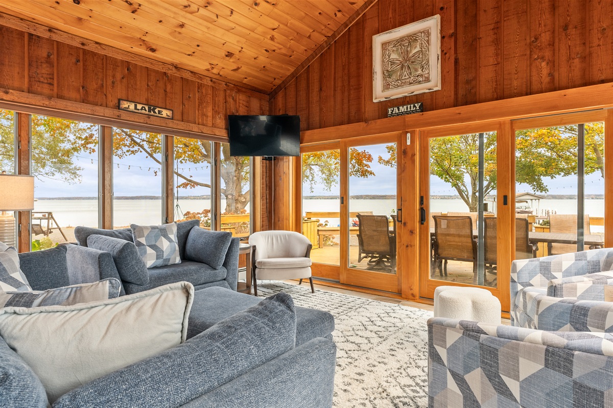 Lakeside lounging at its finest! Enjoy panoramic water views from this cozy living room designed for comfort and connection