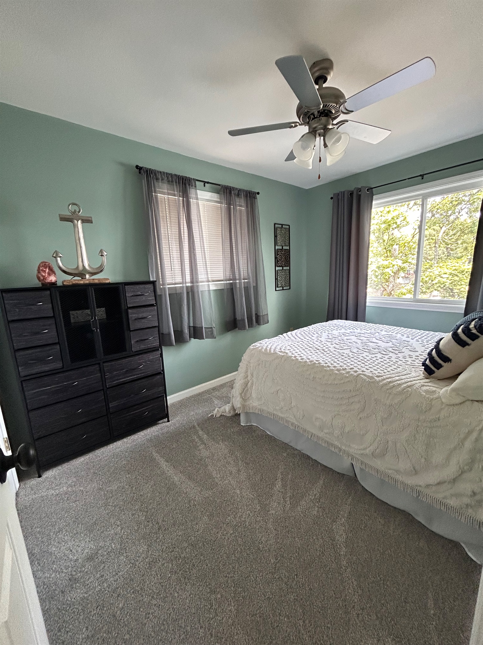 Bedroom with queen bed and beautiful view of lake