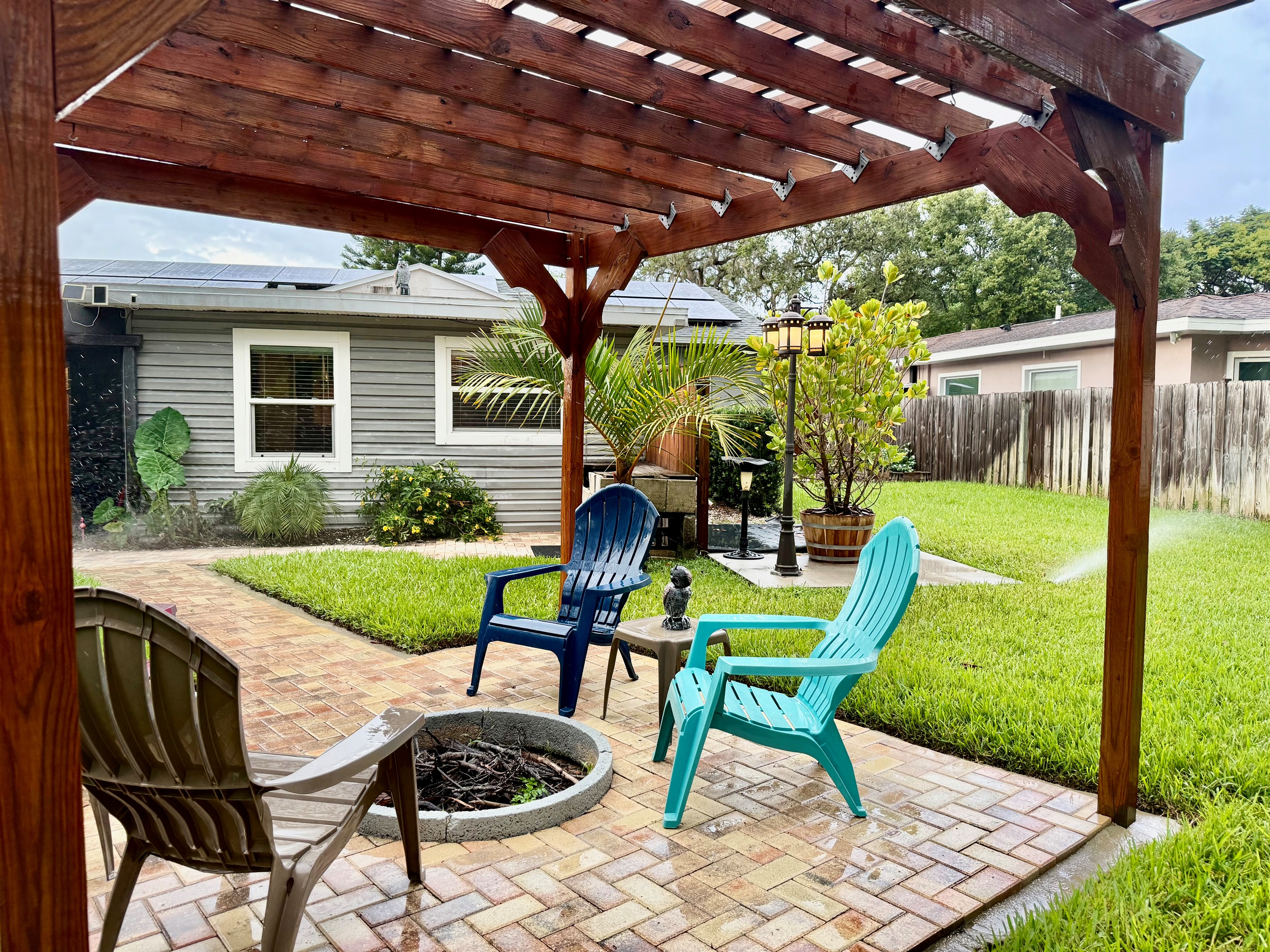 Gather around the fire pit beneath this charming wooden pergola—perfect for roasting marshmallows, sharing stories, or sipping wine under the stars.