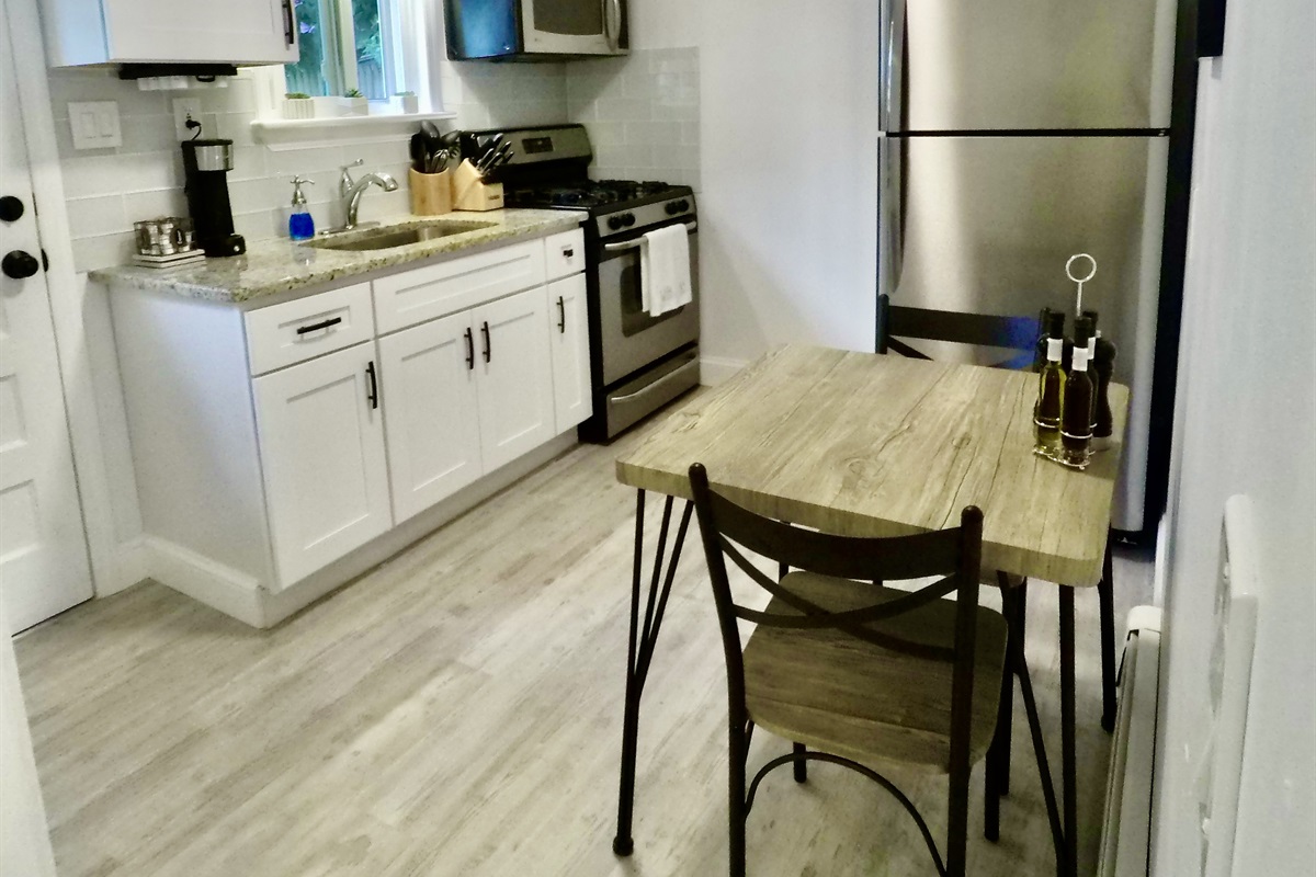 Newly renovated kitchen with granite countertop and stainless steel appliances