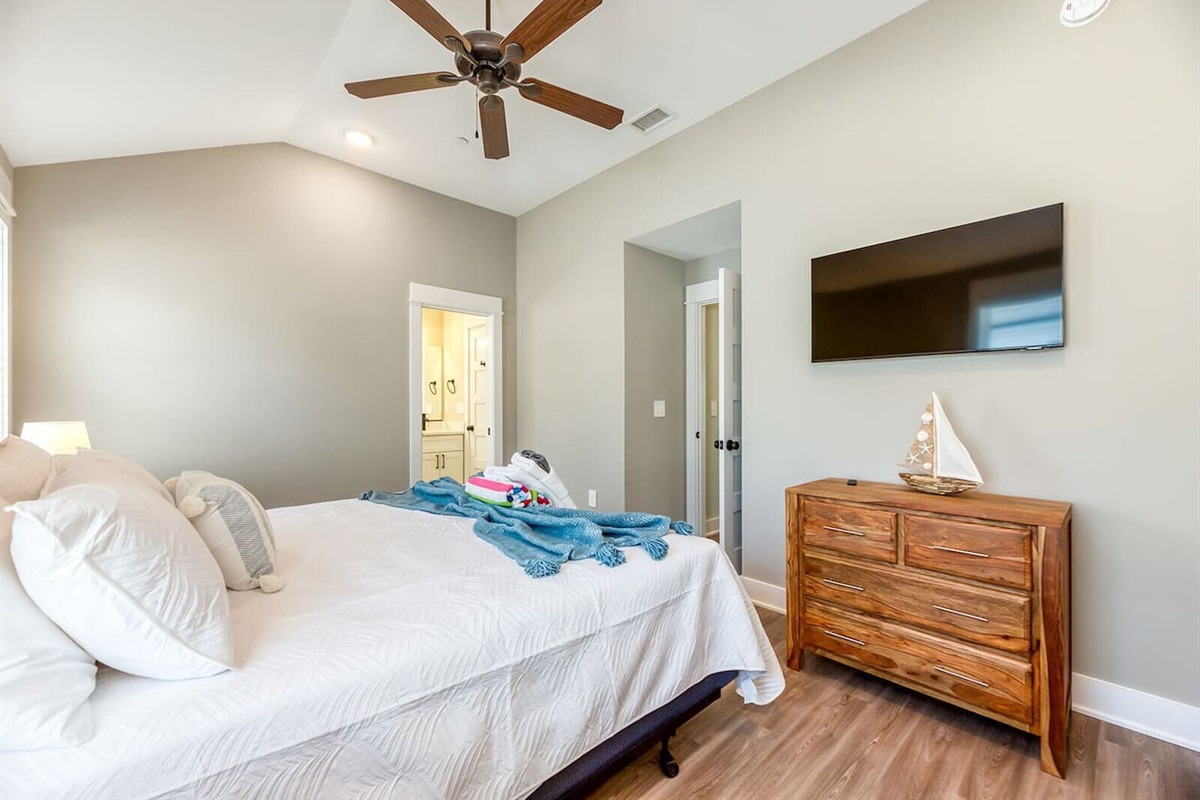 Inviting guest bedroom with a comfortable king-size bed and Smart TV.