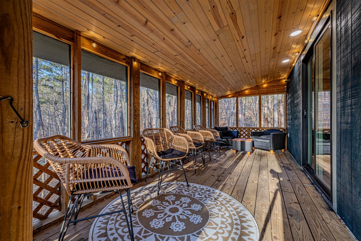 Your year-round mountain retreat! This spacious screened porch is the perfect spot to relax and enjoy the sights and sounds of the forest, rain or shine.