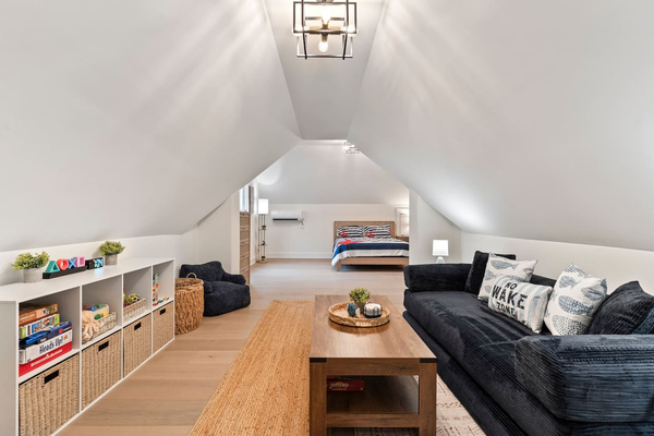 Entrance into the bunk room with kids game and lounge area.