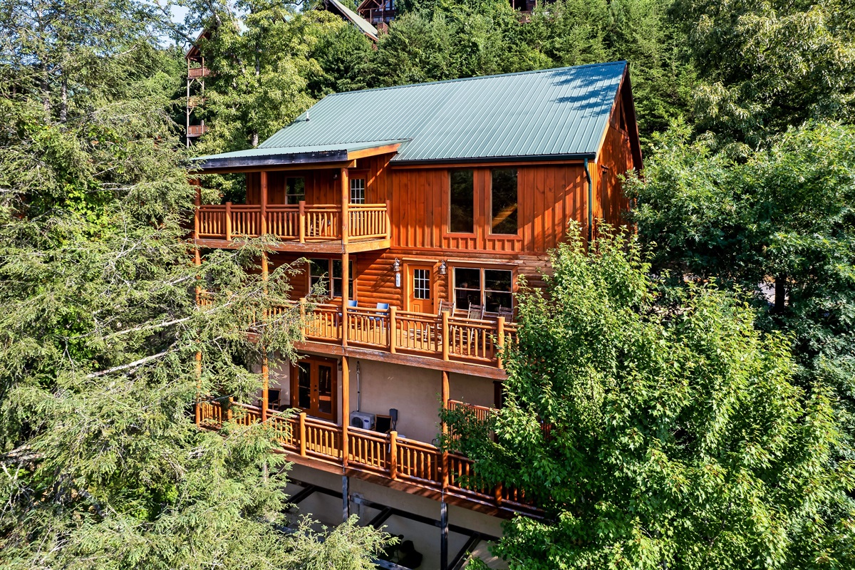 Step back and admire this stunning three story cabin wrapped in trees and views, designed for unforgettable group escapes.
