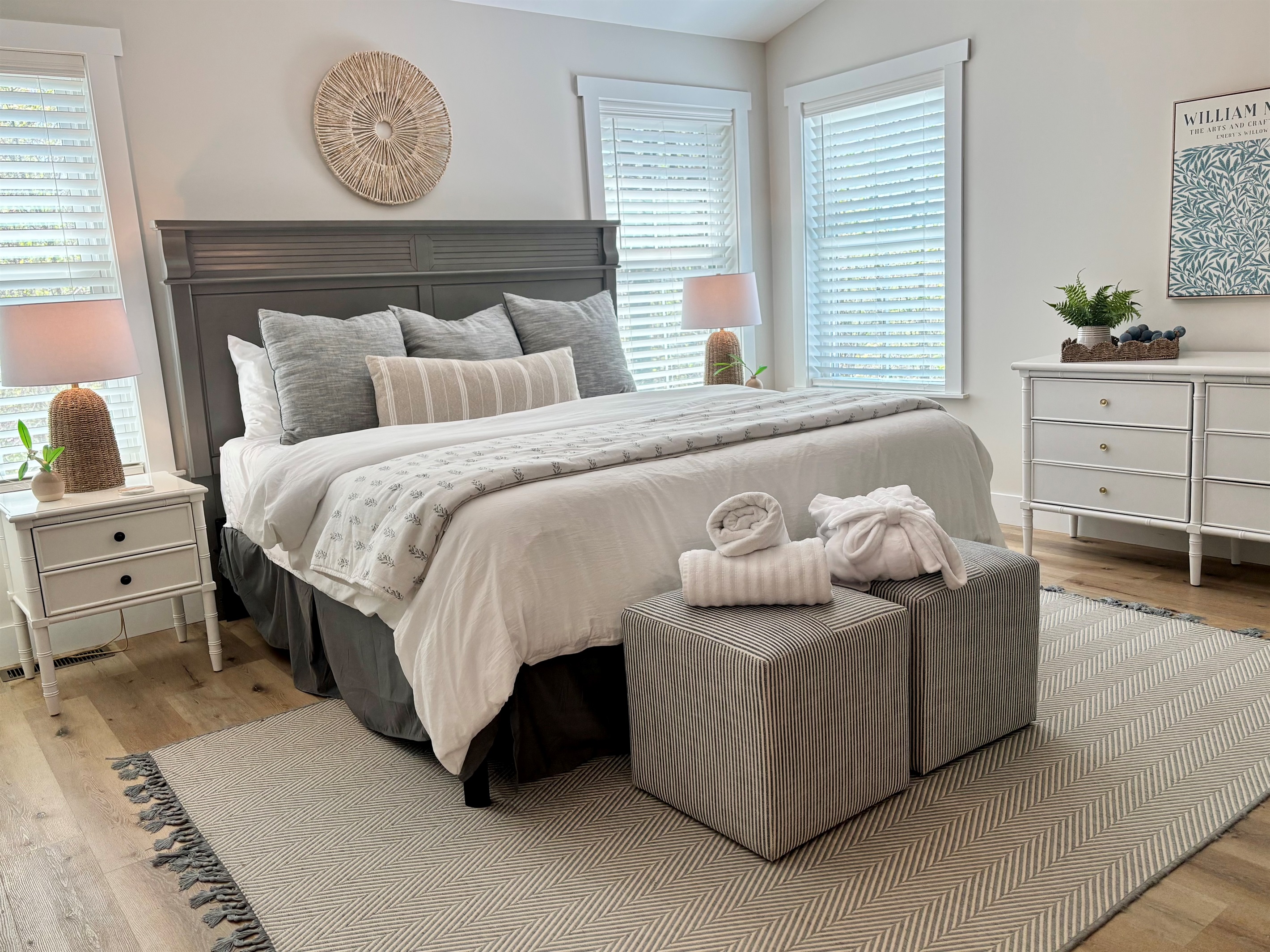 Welcome to your serene getaway! This beautifully designed bedroom features a cozy fireplace and 50" LED TV, vaulted ceilings, stylish decor, and a touch of modern elegance. Perfect for relaxation after a day of adventures. Your tranquil escape awaits!