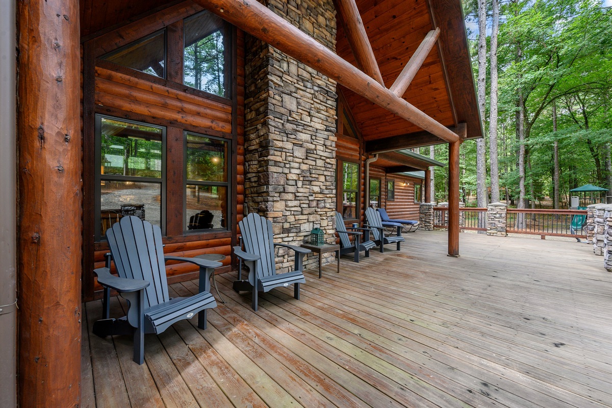 The oversized front porch provides covered areas with seating and open areas for play.