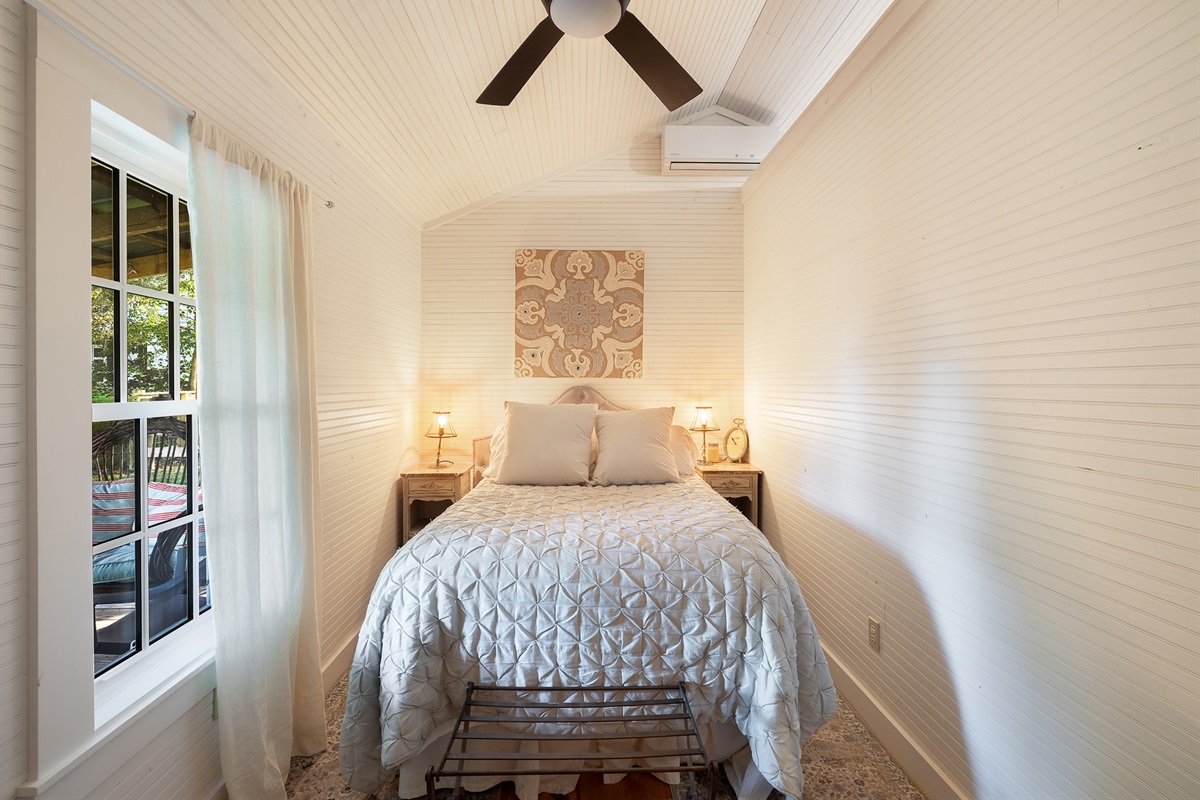 petite bedroom with full bed