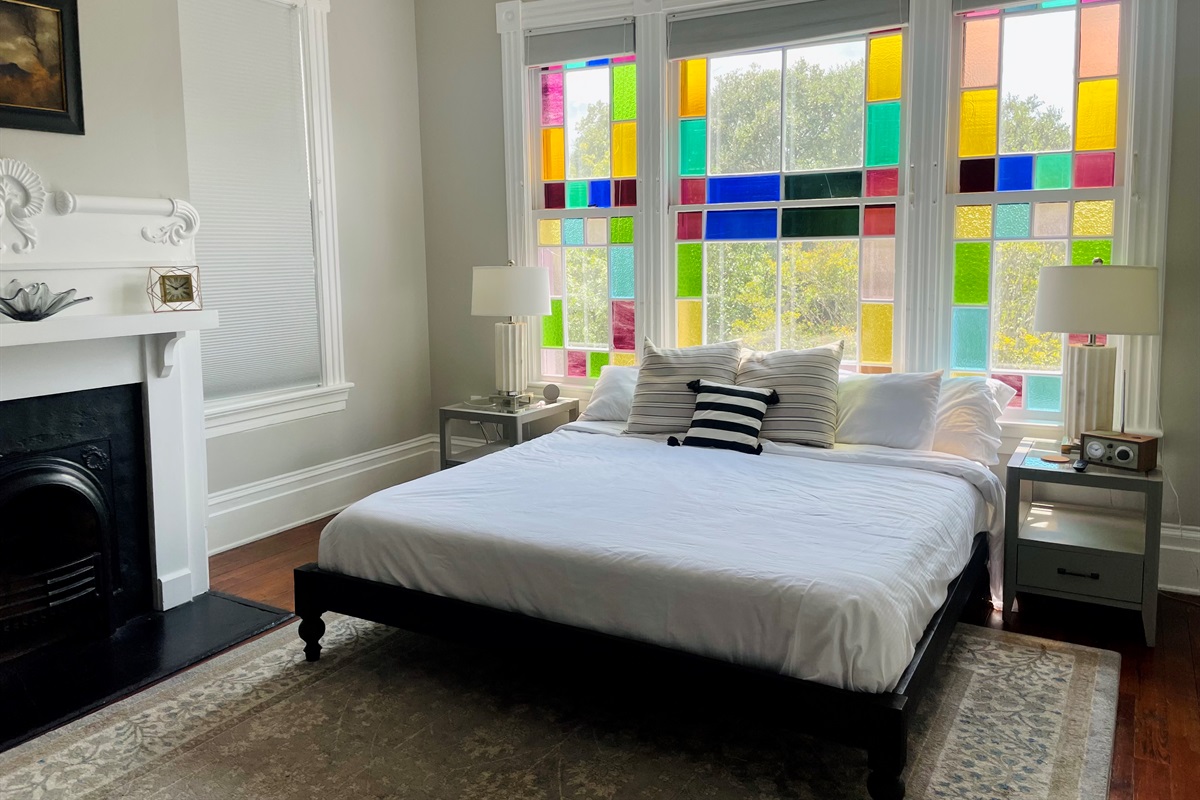 Primary bedroom with ensuite bath is truly a gem.  Stretch out on the king sized bed, enjoying the Savannah sunshine shining through the stain glass windows.  Located on one of the quieter blo