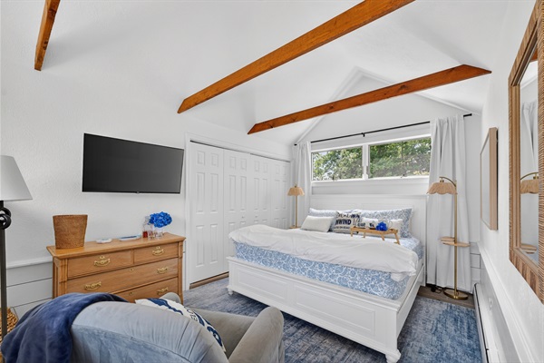 First-floor king suite with private attached bathroom and blackout shades, ideal for stair-free comfort and restful stays.