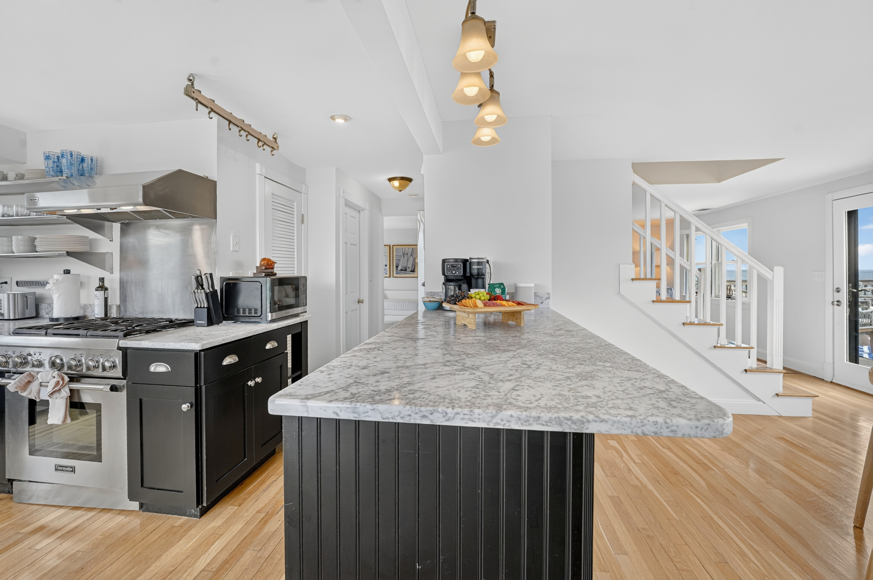 Spacious kitchen island provides plenty of room for preparing meals and gathering together.