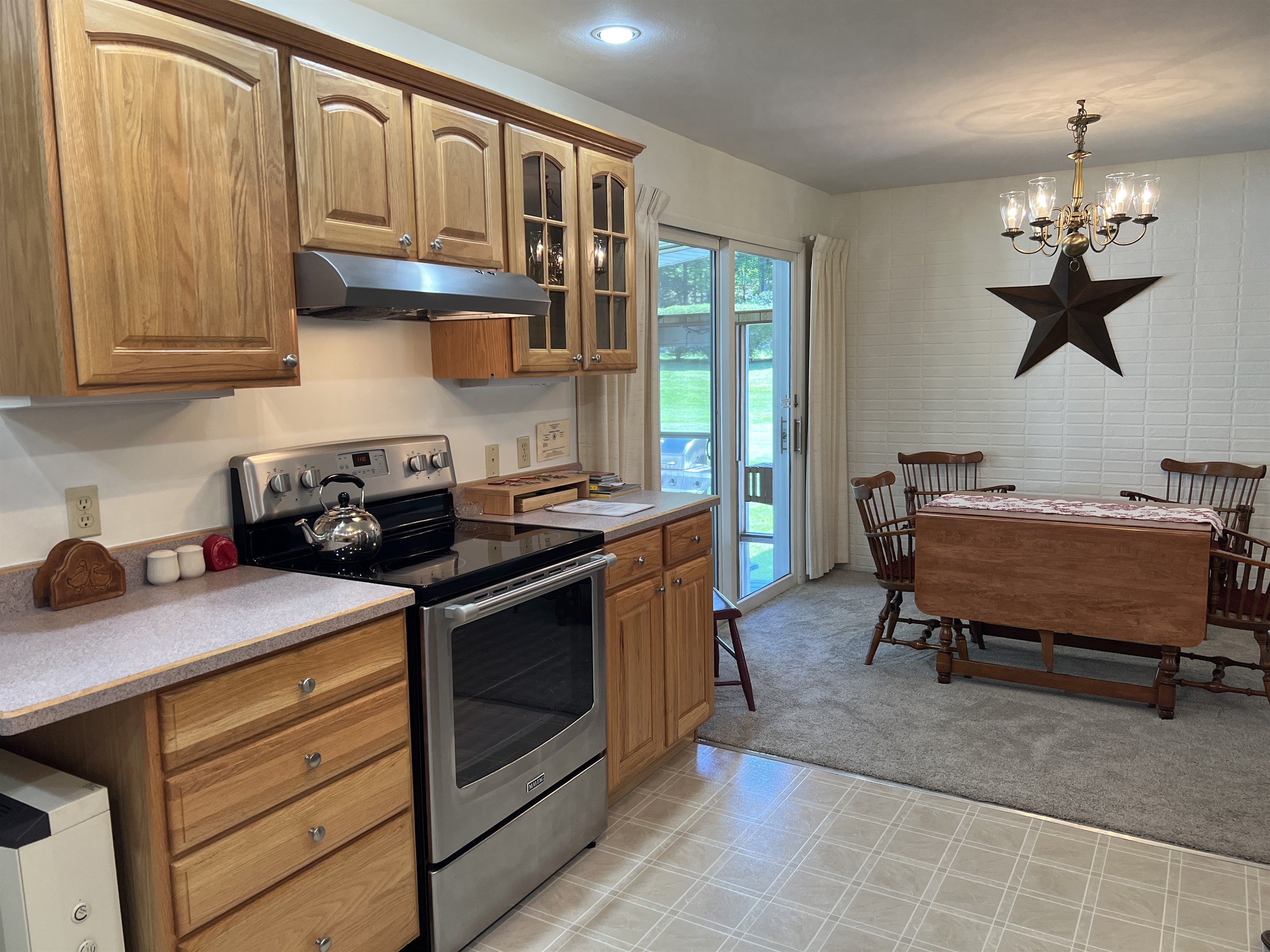 Eat-in kitchen with slider to sunroom
