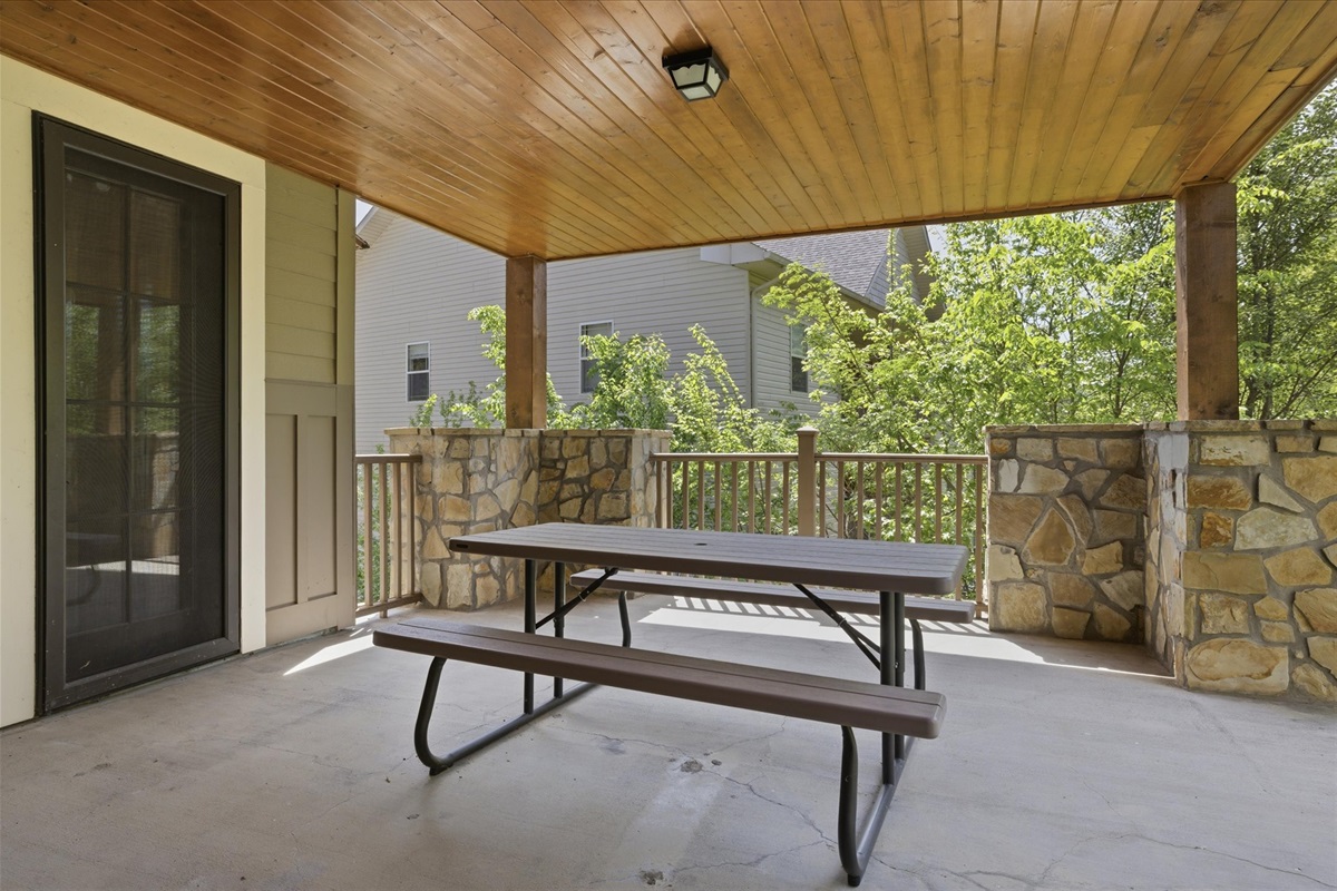 The back porch extends your living space outdoors, giving your group room to sit, connect, and enjoy time together in a relaxed, open setting.
