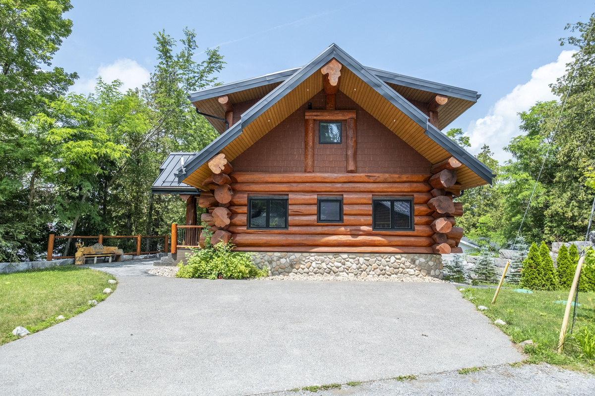 Bear Lodge exterior and driveway on a bright summer day