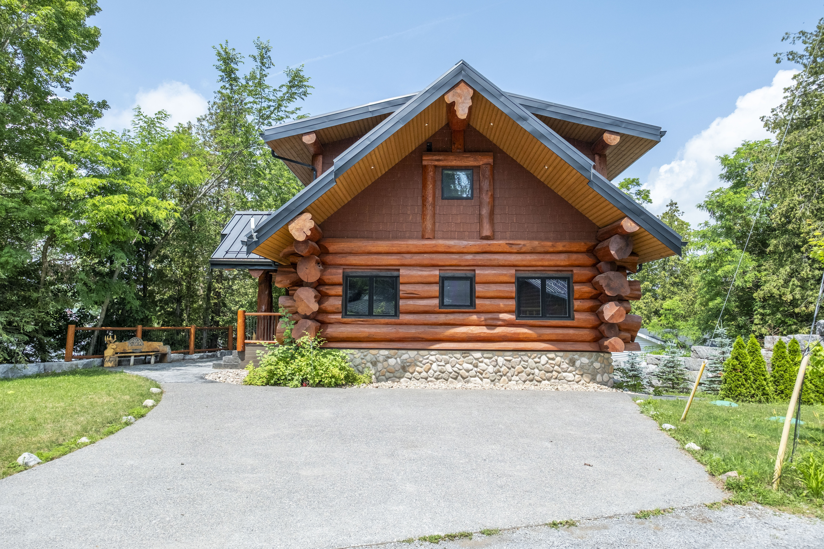 Bear Lodge exterior and driveway on a bright summer day