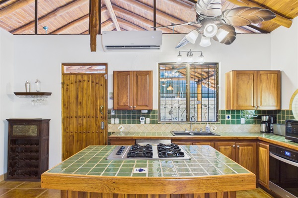Kitchen with Island Seating.  Dishwasher, Oven, and gas range