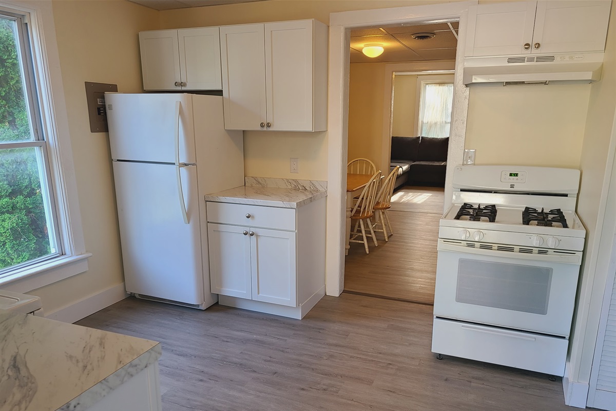 Kitchen with dining room and living room beyond