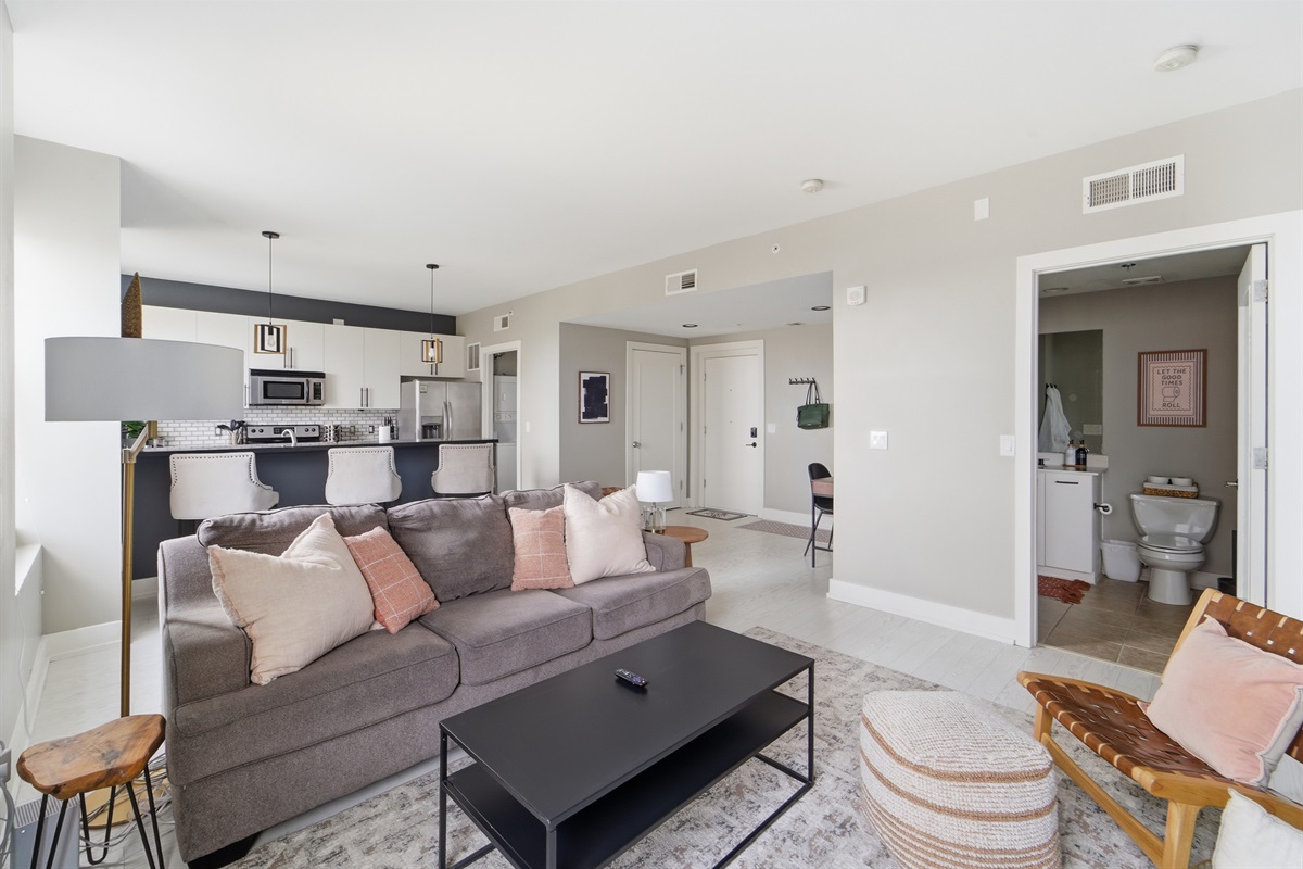 The spacious living room comes equipped with a pullout couch, plush throw pillows and blankets, and fun boardgames for those nights you want to stay in and relax.